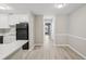 Open-concept kitchen area with modern appliances and new floors at 5203 Oak Charter Ct # 5203, Temple Terrace, FL 33617