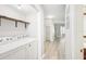 Bright laundry area with full size washer and dryer with view to hallway at 5203 Oak Charter Ct # 5203, Temple Terrace, FL 33617