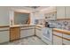 Functional kitchen with ample cabinet space and essential appliances, perfect for everyday meal preparation at 5301 Bayonne Ave, Spring Hill, FL 34608