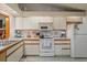 Functional kitchen with ample cabinet space and essential appliances, perfect for everyday meal preparation at 5301 Bayonne Ave, Spring Hill, FL 34608