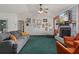 Cozy living room features a charming fireplace, comfortable seating, and stylish decor for relaxed living at 5301 Bayonne Ave, Spring Hill, FL 34608