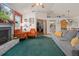 Inviting living room with a fireplace, comfortable seating, view to kitchen, and dining area at 5301 Bayonne Ave, Spring Hill, FL 34608