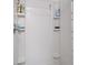 Modern white tiled shower with built-in shelves for toiletries and fixtures at 5301 Bayonne Ave, Spring Hill, FL 34608