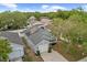 Aerial shot of the house with solar panels, nestled among lush trees at 547 Summer Sails Dr, Valrico, FL 33594
