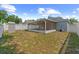 The backyard features a screened-in patio and ample green space at 547 Summer Sails Dr, Valrico, FL 33594