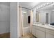 Clean bathroom features tile flooring, a shower with a tub, vanity, and a well-lit mirror at 547 Summer Sails Dr, Valrico, FL 33594