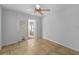 Bright bedroom with tiled floors, ceiling fan, and sliding doors to patio at 547 Summer Sails Dr, Valrico, FL 33594