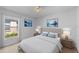 Comfortable bedroom featuring neutral decor, bedside tables with lamps, and a window with natural light at 547 Summer Sails Dr, Valrico, FL 33594