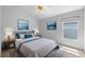 Bright bedroom featuring a ceiling fan, neutral walls, and stylish decor for a relaxing atmosphere at 547 Summer Sails Dr, Valrico, FL 33594