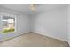 Bedroom with carpeted floor, a large window, and a ceiling fan at 547 Summer Sails Dr, Valrico, FL 33594