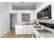 Bright kitchen features white appliances, laminate countertops, and tile floors at 547 Summer Sails Dr, Valrico, FL 33594