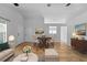 Open-concept living room with a dining area featuring neutral tones, and natural light at 547 Summer Sails Dr, Valrico, FL 33594