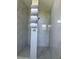 Modern walk-in shower adorned with fresh towels offers a spa-like experience within the home at 5494 Sabal Trace Dr, North Port, FL 34287