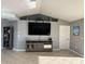 Inviting living room featuring a large TV, contemporary decor, and neutral color palette for cozy gatherings at 5494 Sabal Trace Dr, North Port, FL 34287