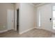 Inviting entryway featuring light wood-look floors, a white front door with sidelight, and neutral paint at 5909 Bibb Ct, North Port, FL 34288