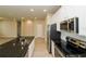 Well-equipped kitchen with stainless steel appliances, a granite countertop island, and white cabinets at 5909 Bibb Ct, North Port, FL 34288
