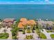 Waterfront home with an orange tile roof boasts great curb appeal and a convenient location at 611 1St S Ave, Tierra Verde, FL 33715