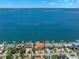 Waterfront home offers direct access to open water with expansive views in a sought-after neighborhood at 611 1St S Ave, Tierra Verde, FL 33715