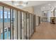 Beautiful hallway with hardwood floors, decorative railing, and ocean views at 611 1St S Ave, Tierra Verde, FL 33715