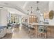 Open concept kitchen with breakfast bar, built-ins and views to breakfast nook at 611 1St S Ave, Tierra Verde, FL 33715