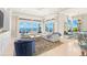 Inviting living area offering serene water views, stylish decor, and comfortable seating arrangements at 611 1St S Ave, Tierra Verde, FL 33715