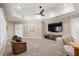 A spacious room with a large tv and comfortable seating creates a relaxing atmosphere at 611 1St S Ave, Tierra Verde, FL 33715