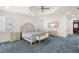 The main bedroom has a sitting area and bedside tables at 611 1St S Ave, Tierra Verde, FL 33715