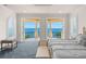 This main bedroom offers views from the balcony at 611 1St S Ave, Tierra Verde, FL 33715