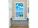 Cozy window seat with storage underneath, offering serene water views and a relaxing space at 611 1St S Ave, Tierra Verde, FL 33715