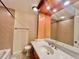 Bathroom with vanity, shower, and tub highlighted by modern tile and fixtures at 702 Lyndhurst St # 822, Dunedin, FL 34698