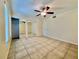 Bright bedroom features a ceiling fan, closet, and neutral walls, creating a cozy atmosphere at 702 Lyndhurst St # 822, Dunedin, FL 34698