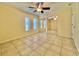 Spacious bedroom with mirrored closet doors and tile flooring, bright and airy at 702 Lyndhurst St # 822, Dunedin, FL 34698