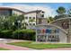 Dunedin City Hall with modern architecture, public parking sign, and manicured landscaping at 702 Lyndhurst St # 822, Dunedin, FL 34698