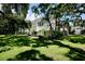 Condo with a well maintained lawn and mature trees at 702 Lyndhurst St # 822, Dunedin, FL 34698