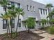 Inviting condo with manicured landscaping and beautiful palm trees adding a touch of tropical paradise at 702 Lyndhurst St # 822, Dunedin, FL 34698