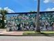 Mural with lots of animals saying 