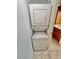 Laundry area featuring a stacked washer and dryer unit at 702 Lyndhurst St # 822, Dunedin, FL 34698
