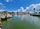 Scenic marina featuring boats docked on the water against a backdrop of lush foliage and blue skies at 702 Lyndhurst St # 822, Dunedin, FL 34698