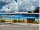 A Dunedin mural with a beach scene and 'Welcome' message provides a vibrant, artsy vibe at 702 Lyndhurst St # 822, Dunedin, FL 34698