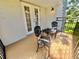 Charming patio area with tile flooring and elegant wrought iron furniture, perfect for relaxing at 702 Lyndhurst St # 822, Dunedin, FL 34698