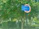 Sign directs to Downtown, Museum, and City Hall amongst lush greenery and landscaping at 702 Lyndhurst St # 822, Dunedin, FL 34698