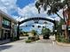 Charming view of a street entrance with the text 'Defending Freedom' at 702 Lyndhurst St # 822, Dunedin, FL 34698