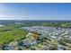 A picturesque aerial view of a charming community surrounded by lush greenery and serene waterways at 7400 Locust Ne St, St Petersburg, FL 33702