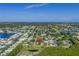 An aerial view highlights the home's proximity to parks, a pond, and waterways at 7400 Locust Ne St, St Petersburg, FL 33702
