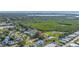An aerial view showcasing the home's location near lush greenery and water features at 7400 Locust Ne St, St Petersburg, FL 33702