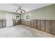 Bedroom under renovation featuring a ceiling fan, window, and door to backyard at 7400 Locust Ne St, St Petersburg, FL 33702