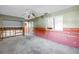 Spacious living room with ceiling fan, ready to be renovated to your liking at 7400 Locust Ne St, St Petersburg, FL 33702
