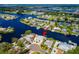 Waterfront home on a canal boasts boat dock, lush landscaping, and serene water views in a waterfront community at 805 Leisey Cir, Ruskin, FL 33570