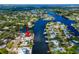 Aerial view of waterfront property with a private boat dock, with canal access to open water at 805 Leisey Cir, Ruskin, FL 33570