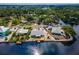 Stunning waterfront home featuring a private dock and lush landscaping along the deep blue canal at 805 Leisey Cir, Ruskin, FL 33570